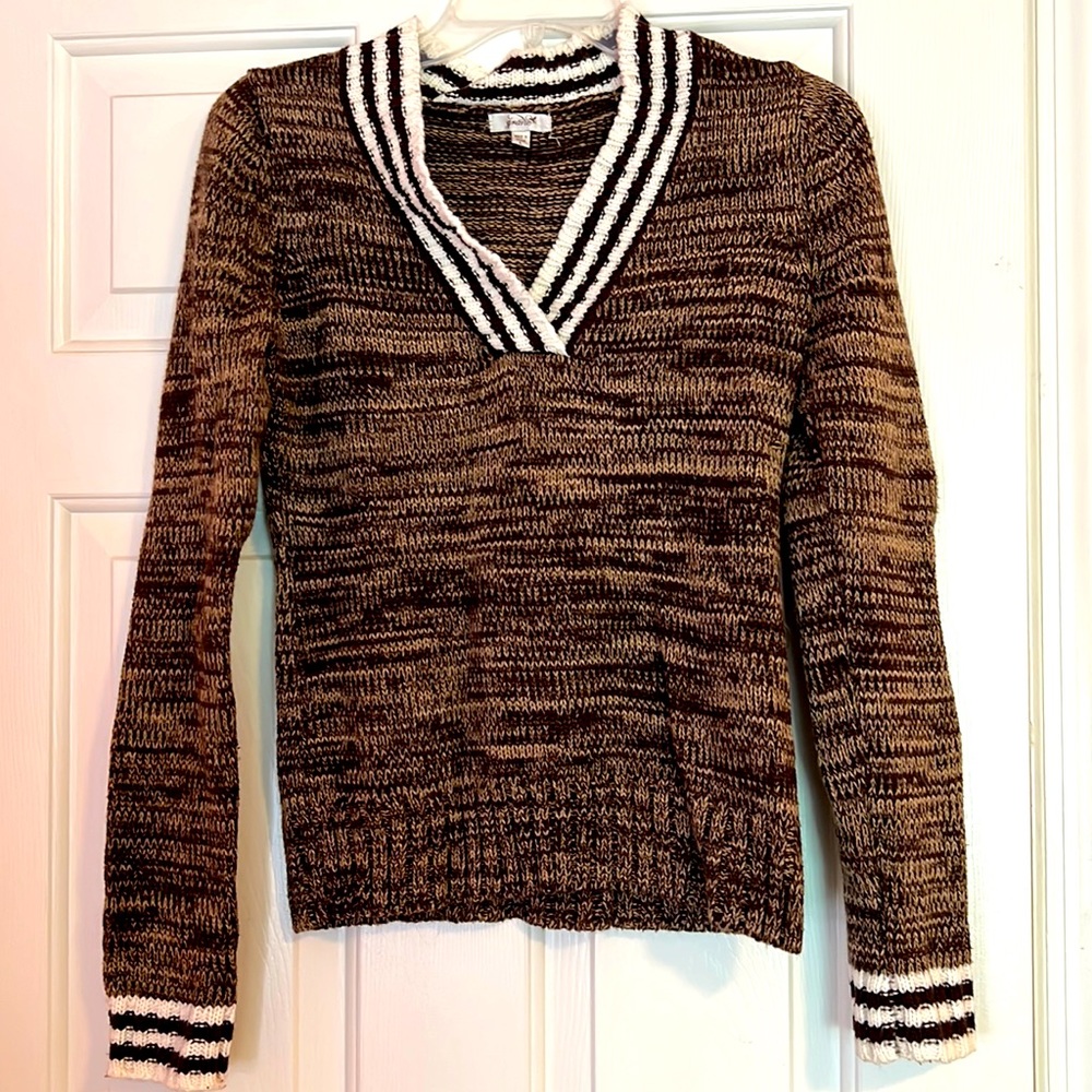 Brown V neck sweater.